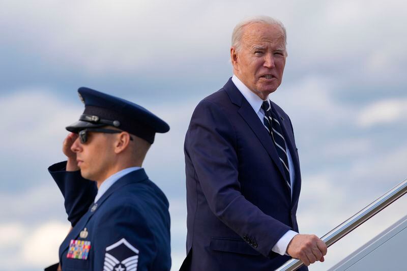 President Joe Biden pauses to respond to a question from a member of the traveling press as he boards Air Force One at Andrews Air Force Base, Md., Friday, April 12, 2024, enroute to New Castle, Del. (AP Photo/Pablo Martinez Monsivais)