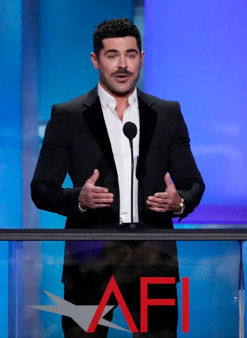 Actor Zac Efron speaks from the stage during the 49th AFI Life Achievement Award tribute to Nicole Kidman, Saturday, April 27, 2024, at the Dolby Theatre in Los Angeles. (AP Photo/Chris Pizzello)
