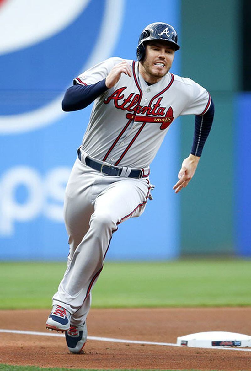 Freddie Freeman rounds third en route to scoring on a double off the bat of Nick Markakis against the Cleveland Indians April 21, 2019, at Progressive Field.