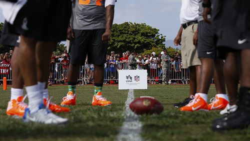 IMAGE DISTRIBUTED FOR USAA - NFL Pro Bowl players from Team Rice gather on the line of scrimmage during an NFL Pro Bowl practice on Earhart Field at Joint Base Pearl Harbor-Hickam sponsored by the USAA the official military sponsor of the NFL on Thursday, Jan. 23, 2014 in Honolulu, Hawaii. (Aaron M. Sprecher/AP Images for USAA) NFL Pro Bowl players from Team Rice gather on the line of scrimmage during an NFL Pro Bowl practice on Earhart Field at Joint Base Pearl Harbor-Hickam sponsored by the USAA in Honolulu, Hawaii. (Aaron M. Sprecher / AP)