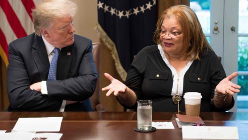 President Donald Trump listens to  Alveda King, niece of Dr. Martin Luther King Jr., during a meeting with inner city pastors at the White House in  2018. King was also  one of  about 20 faith leaders who met with Trump this week.