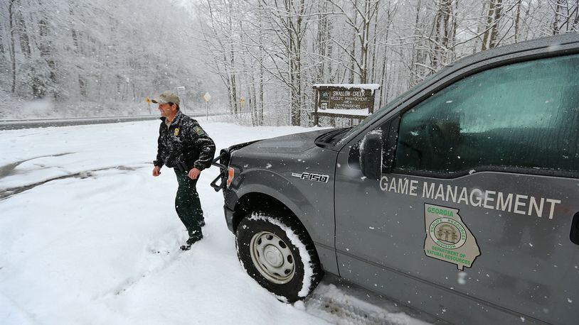In this 2014 photo, Georgia Department of Natural Resources wildlife technician Scott Bardenwerper works Unicoi Gap on the Appalachian Trail to do public assists aiding hikers who were caught out on the trail in a snowstorm north of Helen. Forest Service officials want to avoid this sort of thing here in 2017 as a winter storm approaches north Georgia.