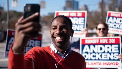 Atlanta mayoral candidate Andre Dickens campaigns across from Park Tavern as voters cast their ballots in the city of Atlanta runoff election Tuesday, Nov. 30, 2021. Ben Gray for the Atlanta Journal-Constitution