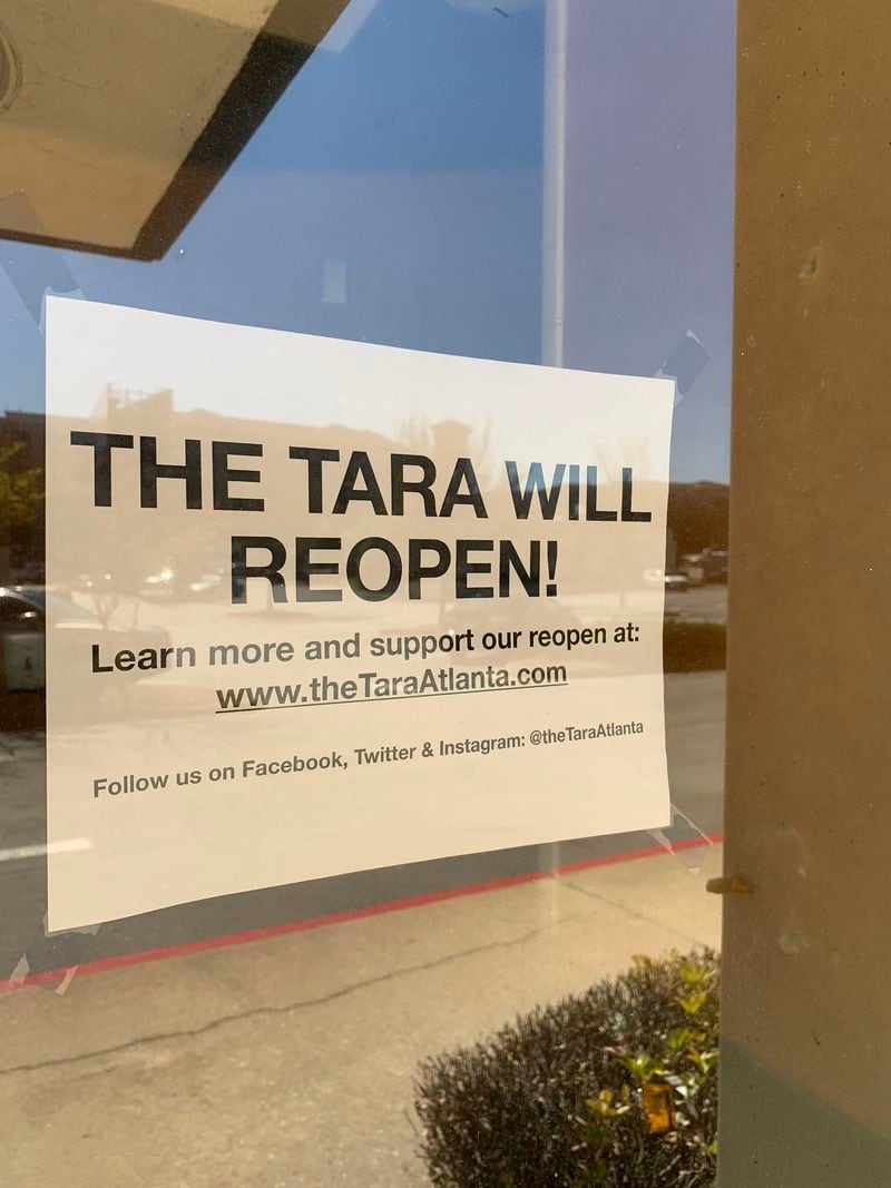 Signs in the entrance of the Tara Theatre soon after Christopher Escobar and a group of investors took over the historic cinema off Cheshire Bridge Road. RODNEY HO/rho@ajc.com