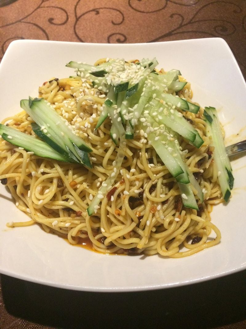 The spicy Sichuan noodles are a lovely starter at Yummy Spicy; they are tossed with sesame dressing and cucumbers and sprinkled with sesame seeds. CONTRIBUTED BY WENDELL BROCK