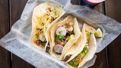 Deep End tacos (from left): “ground beef gringo,” carnitas, and chicken tinga. CONTRIBUTED BY MIA YAKEL