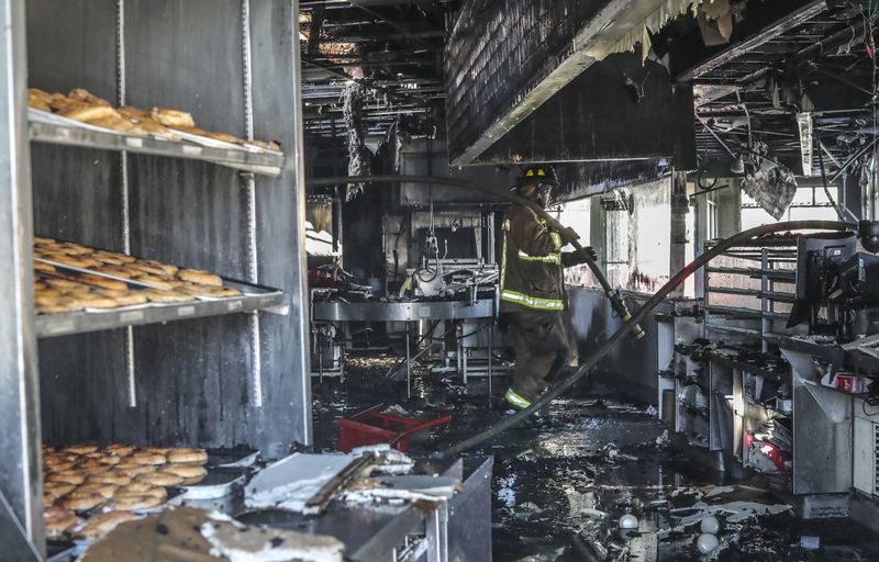 The Midtown Krispy Kreme was gutted in February when a suspected arsonist set fire to the Atlanta landmark, officials said. 

