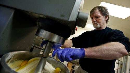 FILE - In this March 10, 2014 file photo, Masterpiece Cakeshop owner Jack Phillips cracks eggs into a cake batter mixer inside his store in Lakewood, Colo. The Supreme Court is taking on a new clash between gay rights and religion in a case about a wedding cake for a same-sex couple in Colorado. The justices said Monday, June 26, 2017, they will consider whether a baker who objects to same-sex marriage on religious grounds can refuse to make a wedding cake for a gay couple.  (AP Photo/Brennan Linsley, File)