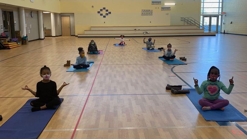 Students at Beecher Hills Elementary School take part in a yoga class as part of The Namaste Project's programing to bring yoga and mindfulness to Atlanta's youth. Courtesy of The Namaste Project