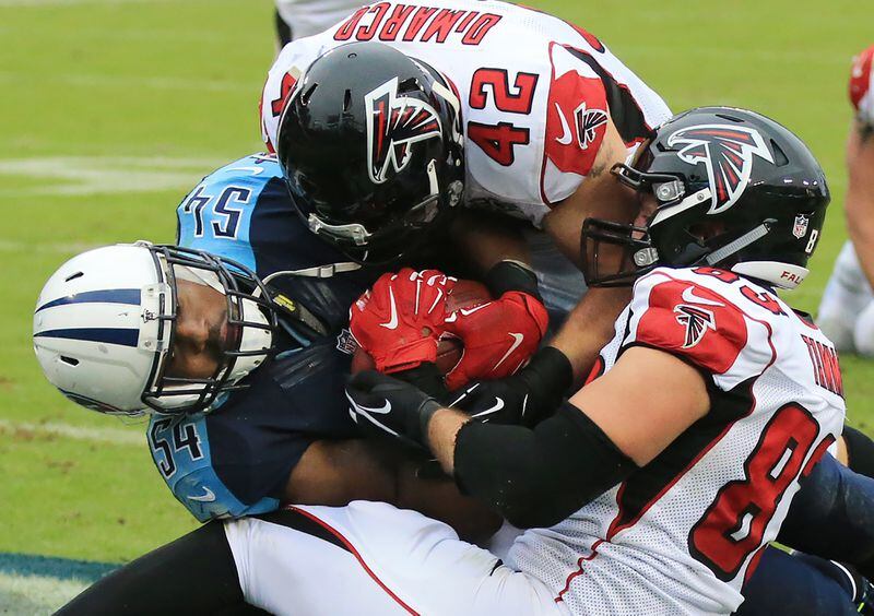 102515 NASHVILLE: -- MATT RYAN INTERCEPTION — Titans Avery Williamson intercepts Falcons Matt Ryan in the endzone pulling the ball away from Falcons Jacob Tamme and Patrick DiMarco during the fourth quarter in a football game on Sunday, Oct. 25, 2015, in Nashville. Curtis Compton / ccompton@ajc.com
