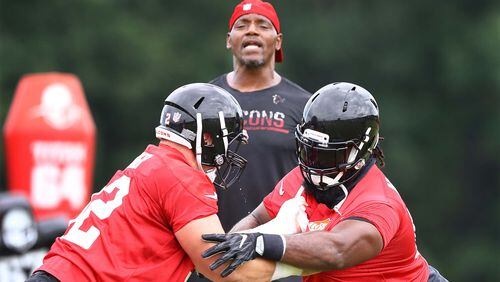 Atlanta Falcons defensive tackle Terrell McClain (right) faces off against Justin Zimmer during mandatory minicamp Thursday, June 14, 2018, in Flowery Branch.