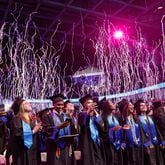 Streamers fall from the ceiling at the conclusion of the Georgia State University J. Mack Robinson College of Business morning graduation ceremony at the Georgia State Convocation Center in Atlanta on Thursday, May 2, 2024. (Natrice Miller/ AJC)