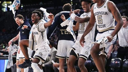 Georgia Tech players (from left) Jose Alvarado, Bubba Parham, Khalid Moore and Moses Wright react as teammate Niko Broadway makes a reverse layup for a basket in the final minutes of a 82-54 victory over Morehouse in a NCAA college basketball game on Tuesday, January 28, 2020, in Atlanta.   Curtis Compton ccompton@ajc.com