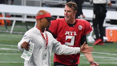 Falcons general manager Terry Fontenot and quarterback Matt Ryan (2) talk as they leave the field after the 2021 AT&T Atlanta Falcons Training Camp: Dirty Birds Open Practice at the Mercedes-Benz Stadium on Saturday, August 7, 2021. (Hyosub Shin / Hyosub.Shin@ajc.com)