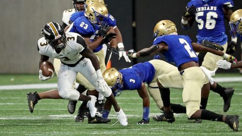 Colquitt County running back Daijun Edwards (3) makes a move against McEachern defensive back Erwin Bryd (2) in the first half during the Corky Kell Classic game Saturday, Aug. 18, 2018, at Mercedes-Benz Stadium in Atlanta.