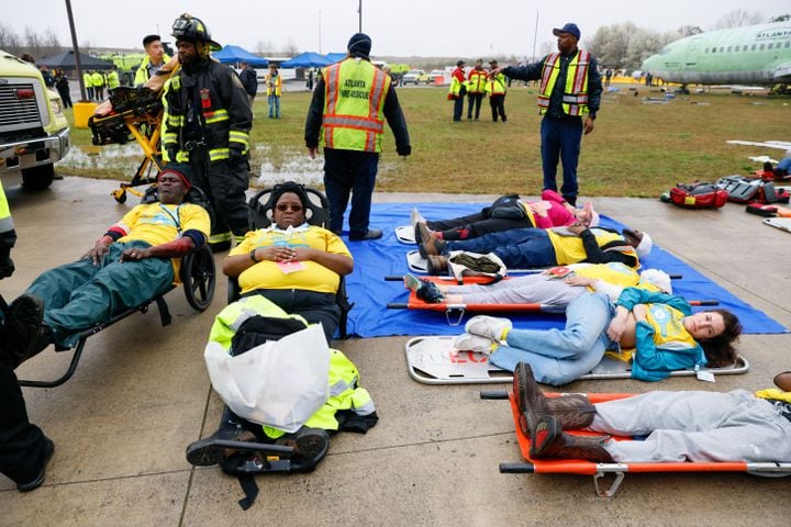 Fake victims awaits to be transported to emergency vehicles during a full-scale disaster drill at Hartsfield-Jackson International Airport  with Atlanta Firefighters, law enforcement, rescue personnel, and nearly 70 volunteers who participated in a triennial exercise known as “Big Bird” on Wednesday, March 6, 2024
Miguel Martinez /miguel.martinezjimenez@ajc.com