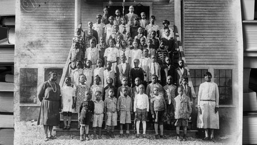 Two teachers and 55 students were photographed in the 1920s in front of the Jefferson Jacob School in Kentucky. Andrew Feiler reproduced the photo for his book on the Rosenwald Schools. Early in the school building program, Booker T. Washington sent Julius Rosenwald photographs like this of schoolchildren and teachers standing proudly in front of their schools. Rosenwald was deeply moved by these images, and they contributed to his decision to expand the initiative; he eventually built almost 5,000 schools for Black children. Photo: Andrew Feiler