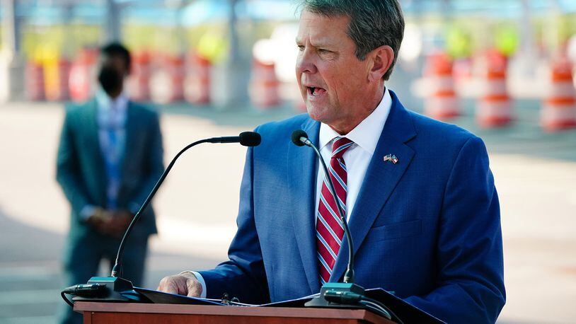 Gov. Brian Kemp signed into law the state's midyear budget this past week, paving the way for tax refunds, raises for state workers and University System of Georgia employees, and bonuses for public school educators. (Elijah Nouvelage/Getty Images/TNS)