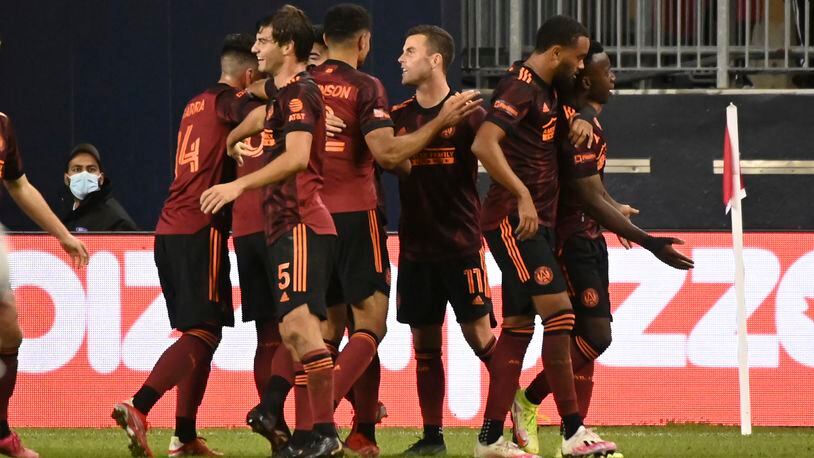 Atlanta United players celebrate a goal against Toronto FC during the second half of an MLS soccer match Saturday, Oct. 16, 2021, in Toronto. (Jon Blacker/The Canadian Press via AP)