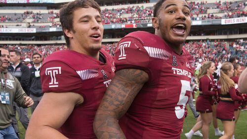 Kevin DeCaesar and Shaun Bradley of the Temple Owls celebrate after the game against the Cincinnati Bearcats at Lincoln Financial Field on October 20, 2018 in Philadelphia, Pennsylvania. The Temple Owls defeated the Cincinnati Bearcats 24-17 in overtime. (Photo by Mitchell Leff/Getty Images)