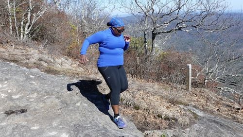 Mirna Valerio of Rabun Gap runs across the top of Whiteside Mountain in Cashiers, N.C. Valerio, author of the popular Fat Girl Running blog, is out to prove that fat girls can be fit, too. CONTRIBUTED BY ALLEN TAYLOR JR.