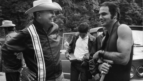 Poet, novelist and screenwriter James Dickey chats with star Burt Reynolds on the set of 1972’s “Deliverance.”