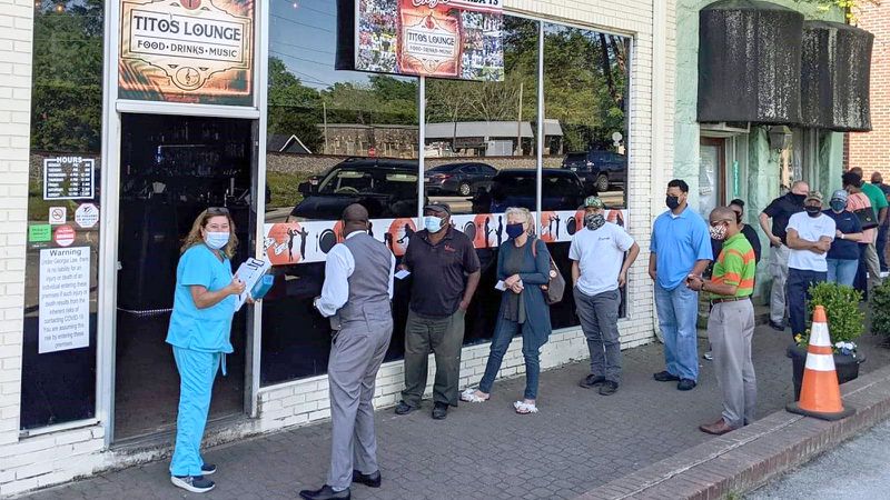 Premier Drugstore's most successful outside vaccination clinics have been at Tito's Lounge in Douglasville.  The lounge made up slogans like "Get your shot, Have a shot." (Courtesy of Bryan Green)