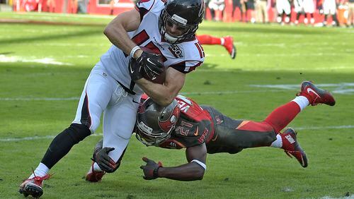 Atlanta Falcons wide receiver Nick Williams eludes Tampa Bay Buccaneers cornerback Alterraun Verner (21) as he scores on a 5-yard touchdown reception during the fourth quarter of an NFL football game Sunday, Dec. 6, 2015, in Tampa, Fla. (AP Photo/Phelan M. Ebenhack)
