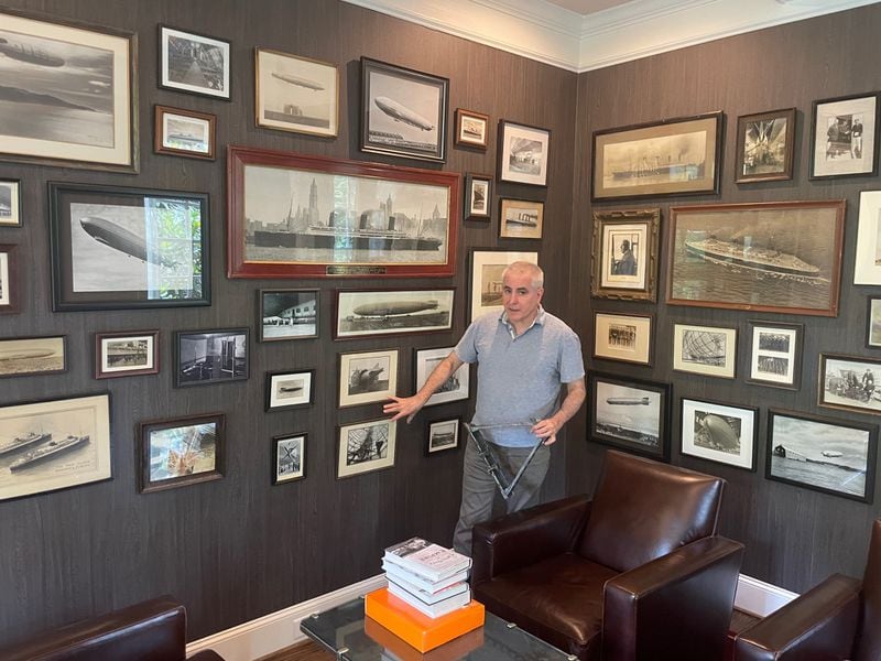 Dan Grossman, an Atlanta lawyer and an expert on airships from long ago, holds a piece of the Hindenburg's metal frame in his home. He takes part in a PBS "NOVA" documentary on the disaster. (Photo by Bill Torpy)
