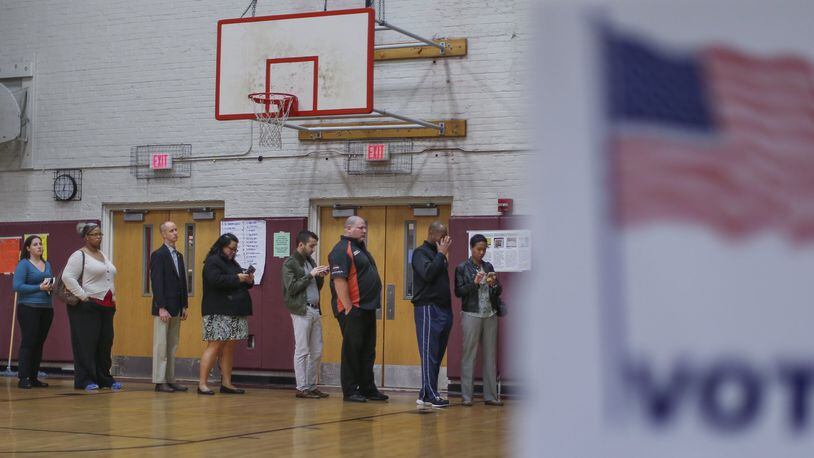 Voters line up to cast ballots at Henry W. Grady High School in Atlanta for Georgia’s presidential primary in 2016. A date has not been set yet for the state's presidential primary in 2024. JOHN SPINK / JSPINK@AJC.COM