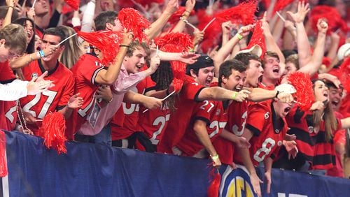 Georgia  fans react after a touchdown  in the SEC Championship game at Mercedes-Benz Stadium on Dec. 2.