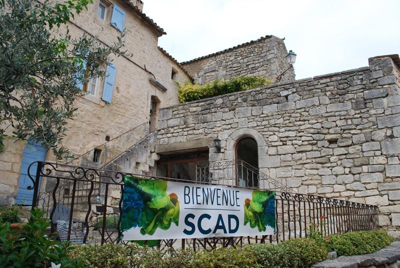 A banner welcomes visitors to the Savannah College of Art and Design’s campus in Lacoste, France. ALAN JUDD/ajudd@ajc.com