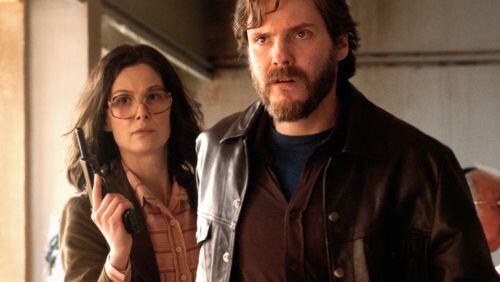 Rosamund Pike (left) stars as “Brigitte Kuhlman” and Daniel Brühl (right) stars as“Wilfred Bose” in José Padilha’s “7 Days in Entebbe.” Contributed by Liam Daniel / Focus Features