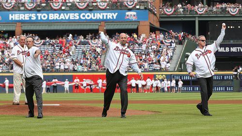 Hall of Fame manager Bobby Cox (from left) looks on as Hall of Fame pitchers Greg Maddux, John Smoltz and Tom Glavine throw out the first pitch for the Braves’ final game at Turner Field on Oct. 2. (Curtis Compton /ccompton@ajc.com)