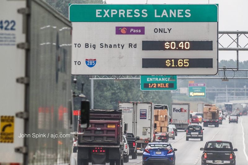 Monday was the first morning that drivers had to pay to use the Northwest Corridor Express Lanes in Cobb County. JOHN SPINK / JSPINK@AJC.COM