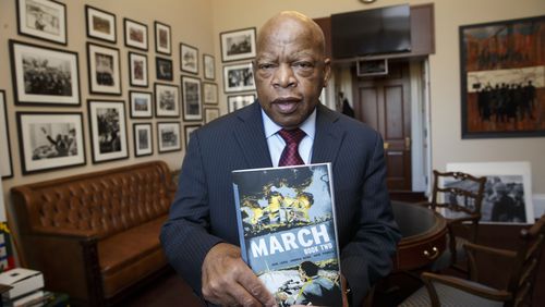 Rep. John Lewis, D-Ga., holds the new installment of his award-winning graphic novel on civil rights and nonviolent protest, on Capitol Hill in Washington. A comic book about Martin Luther King Jr. helped bring John Lewis into the civil rights movement. The longtime Democratic congressman from Georgia now hopes that graphic novels about his life and what his contemporaries endured to overcome racism will guide today's protesters in search of justice. (AP Photo/J. Scott Applewhite)