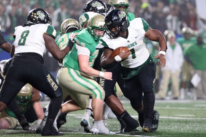 Langston Hughes running back Antonio Martin (1) scores a rushing touchdown in the first half against Buford in the Class 6A state title football game at Georgia State Center Parc Stadium Friday, December 10, 2021, Atlanta. JASON GETZ FOR THE ATLANTA JOURNAL-CONSTITUTION