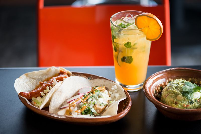 Offerings from ATL Taco, a new restaurant from Shaun Doty and Lance Gummere, include ATL Hot Chicken Taco and Chili Marinated Chicken with El Buckhead cocktail. CONTRIBUTED BY MIA YAKEL