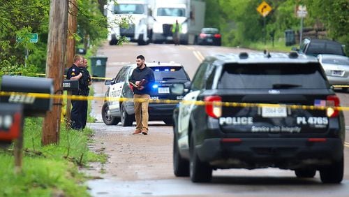 An investigator speaks with officers. Police tape of an area of the 3300 block of Dodson Avenue following a shooting April 14. (Photo Courtesy of Olivia Ross)