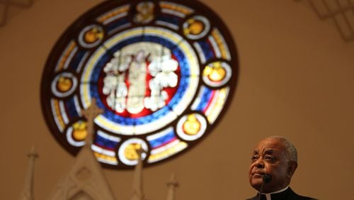 March 25, 2016 Atlanta - Archbishop Wilton D. Gregory gives the opening reflection for the 36th Annual Good Friday Pilgrimage at the Shrine of the Immaculate Conception Catholic Church. Attendants commemorated the stations of the cross along the pilgrimage and reflected on issues at every station. TAYLOR CARPENTER / TAYLOR.CARPENTER@AJC.COM