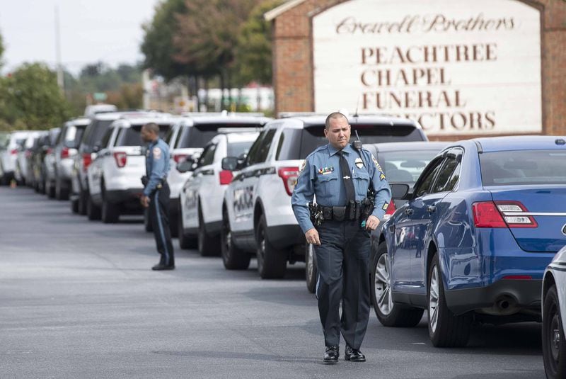 10/23/2018 — Peachtree Corners, Georgia — Friends, Family, police officers and community members arrive for the visitation for slain Gwinnett County police officer Antwan Toney at Crowell Brothers Funeral Home in Peachtree Corners on Tuesday. Officer Toney was allegedly shot and killed by 18-year-old Tafahree Maynard on Saturday while investigating a call for a “suspicious vehicle” near Shiloh Middle School in unincorporated Snellville. (ALYSSA POINTER/ALYSSA.POINTER@AJC.COM)