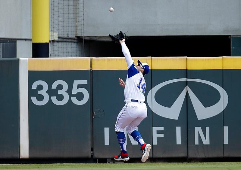 Atlanta Braves' Adam Duvall catches a ball hit by Milwaukee Brewers' Jackie Bradley Jr. in the third inning of a baseball game Sunday, Aug. 1, 2021, in Atlanta. (AP Photo/Ben Margot)