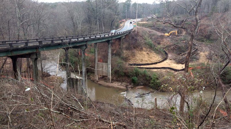 From March 2017, here’s a similar view of Arnold Mill Road, which is also Ga. 140, just east of the bridge over Little River. This photo was taken before construction began on the replacement bridge.