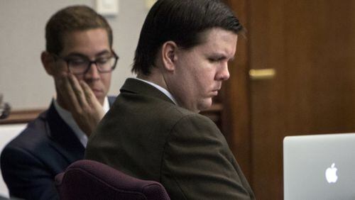 A downcast Justin Ross Harris listens to Cobb County Senior Assistant District Attorney Chuck Boring’s opening statement on Monday. (Stephen B. Morton / The Atlanta Journal-Constitution)