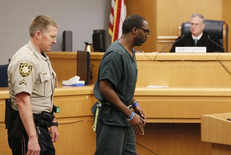 April 25, 2019 - Lawrenceville - Emani Moss’ father is escorted from court after he testified at his wife’s capital murder trial. Eman Moss agreed to a plea deal that allowed him to avoid the penalty in exchange for testifying against Tiffany Moss. The prosecution continued for the second day in the Tiffany Moss death penalty trial at Gwinnett County Superior Court with the testimony of Eman Moss. Tiffany Moss, who is representing herself, again declined to ask questions of the prosecution witnesses.