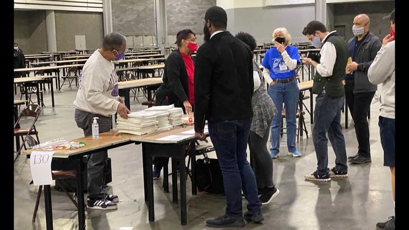 The final team of Fulton County workers finishes its recount of votes shortly before 4 p.m., earlier than anticipated, on Sunday, Nov. 15, 2020. ADRIANNE MURCHISON/adrianne.murchison@ajc.com.