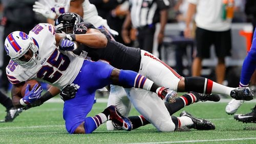 ATLANTA, GA - OCTOBER 01: LeSean McCoy #25 of the Buffalo Bills is tackled by Jack Crawford #95 of the Atlanta Falcons during the first half at Mercedes-Benz Stadium on October 1, 2017 in Atlanta, Georgia. (Photo by Kevin C.  Cox/Getty Images)