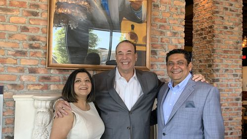 Jon Taffer with Taffer's Tavern franchise partner Gaurav Dhami (right) and his wife Manjari after a ribbon cutting April 13, 2021. RODNEY HO