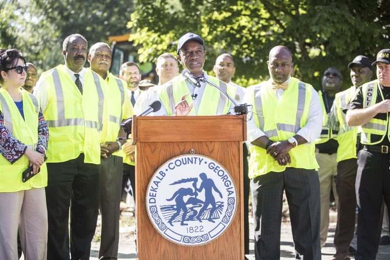 DeKalb CEO Michael Thurmond holds a 2017 press conference announcing two building demolitions at Brannon Hill Condominiums, which is persistently dangerous and dilapidated.  He said the county demolished more than 100 multifamily properties since he took office, but most of them were units at this complex. (Chad Rhym/AJC file)
