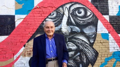 Morris Habif, 91, next to one of the buildings on Pryor Street he once owned.